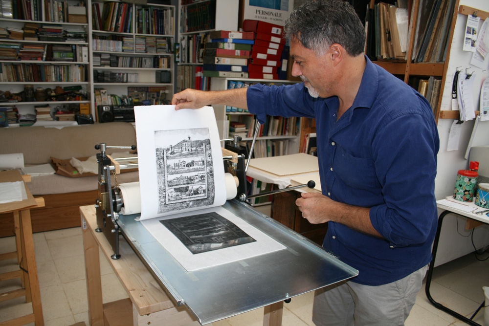 Assistant Alessandro pulls the print for Corte Franca